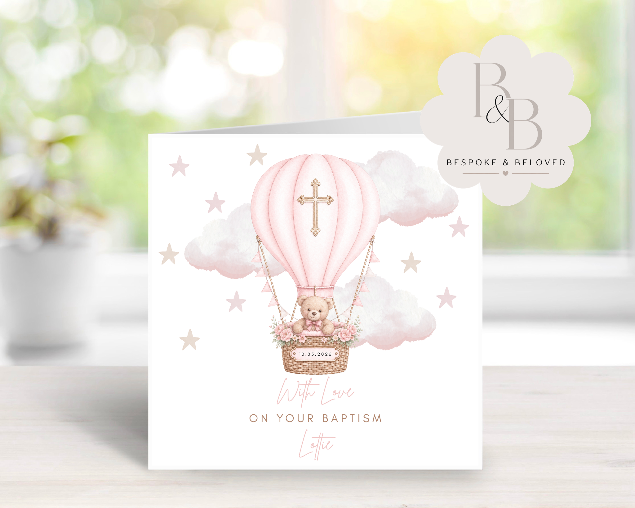 Greeting card with a teddy bear in a pink hot air balloon for a baptism