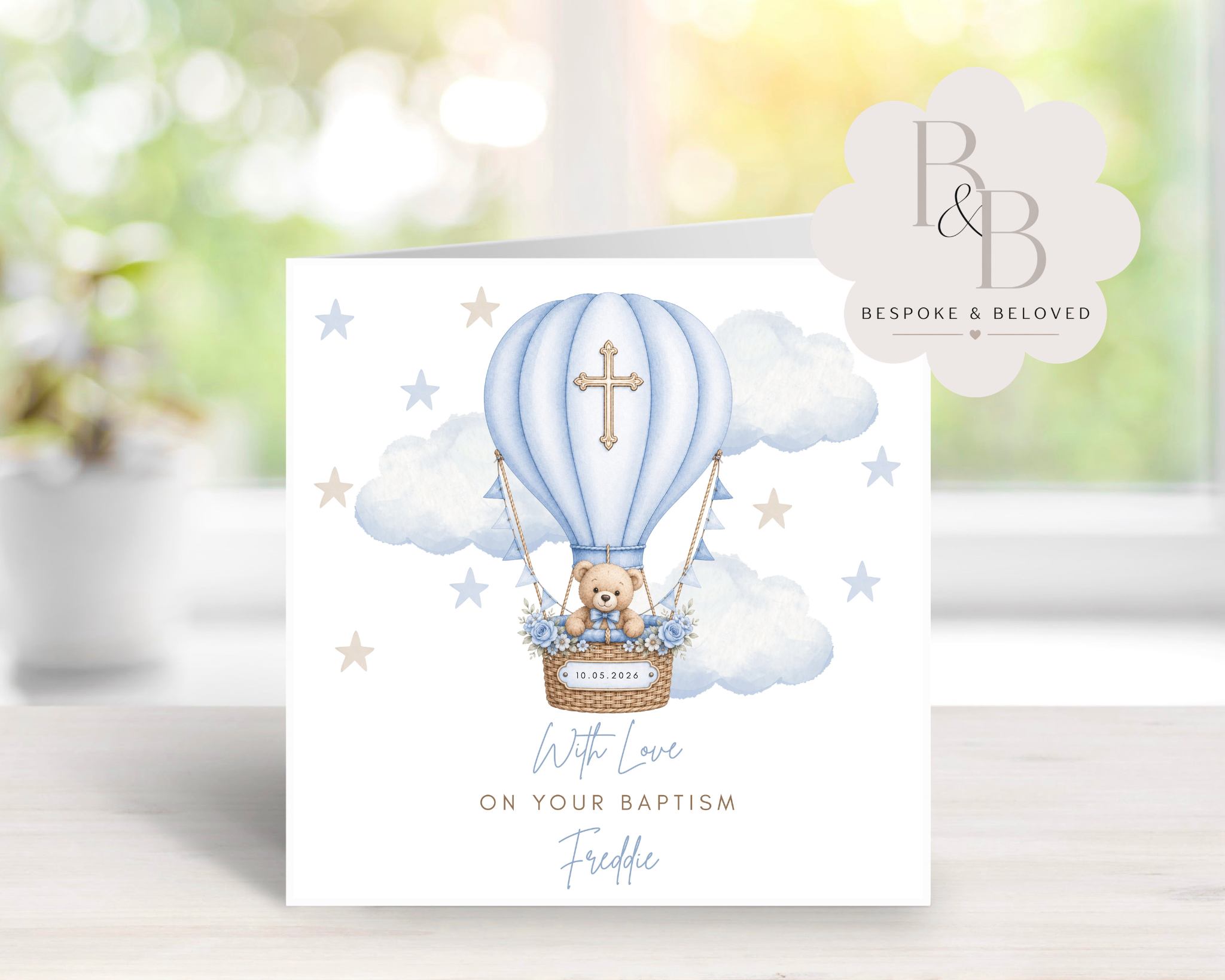 Greeting card with a teddy bear in a blue hot air balloon for a baptism