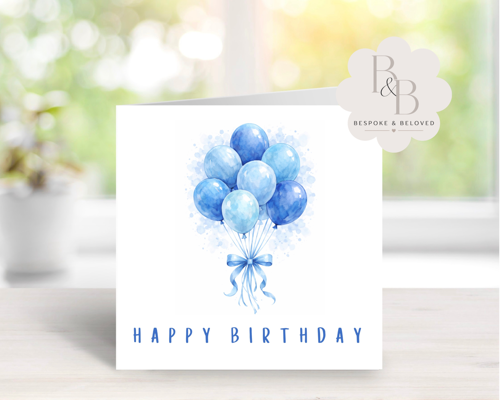 Watercolor balloon happy birthday card in blue design on white background