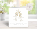 Wedding card with champagne glasses and initials 