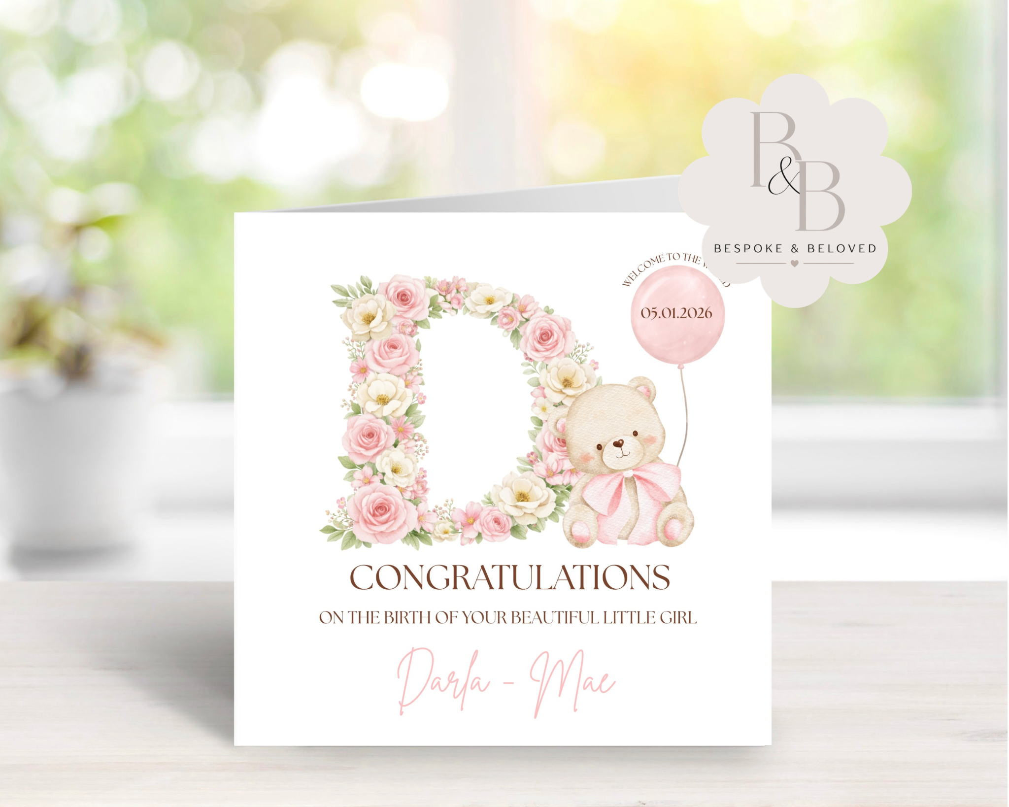 Baby shower card with teddy bear, flowers, and balloon