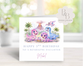Personalised dinosaur birthday card for kids featuring watercolour dinosaurs and a roarsome volcano scene, customised with name and age