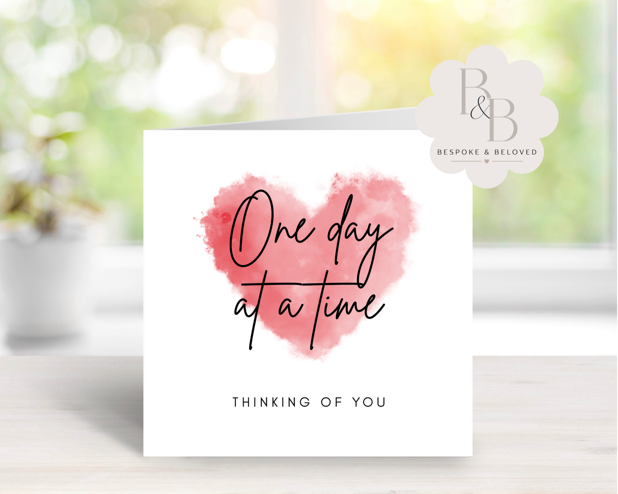 Card with pink heart and text 'One day at a time, thinking of you' 