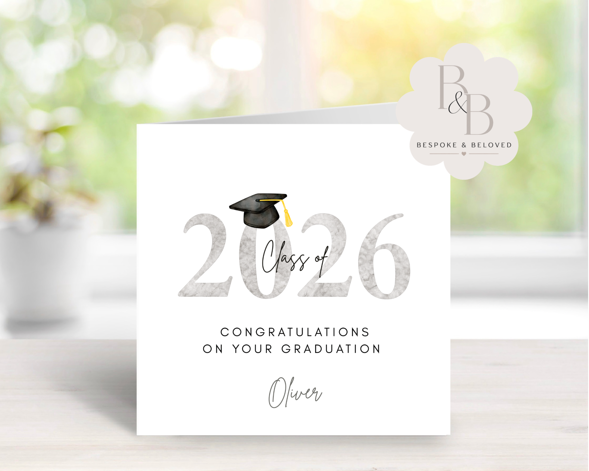 Grey graduation card with 'Class of 2026' text and a graduation cap design