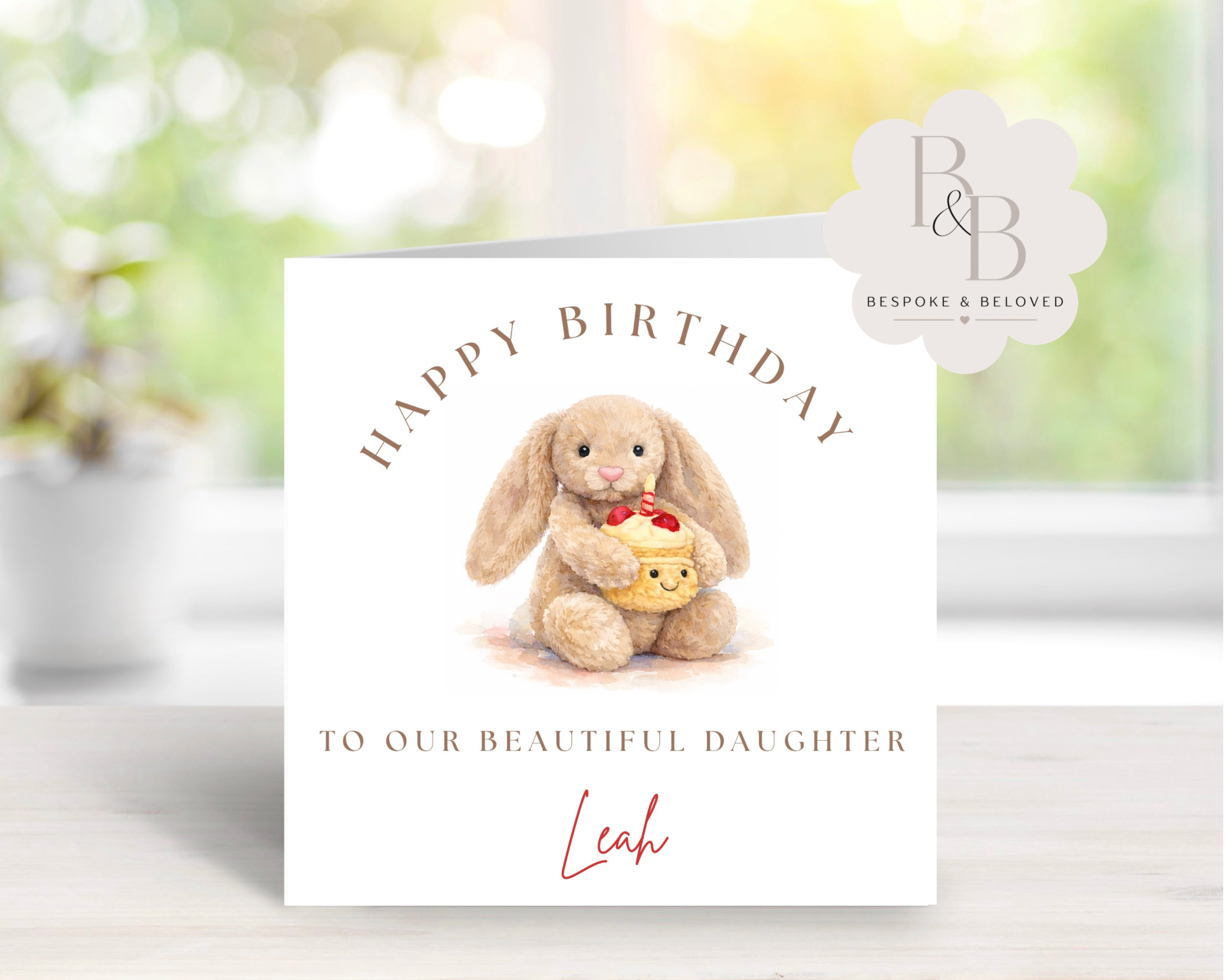 Personalised birthday card with a plush bunny holding a cupcake