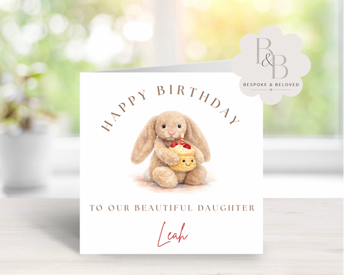 Personalised birthday card with a plush bunny holding a cupcake