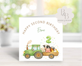 Birthday card with a green tractor and animals 
