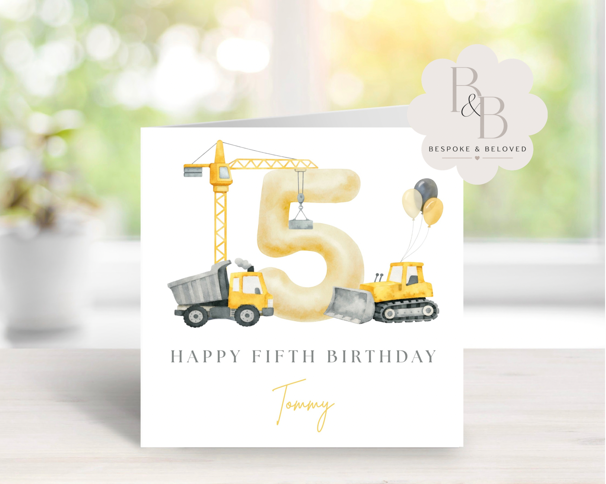Construction-themed birthday card with  cranes, and trucks 